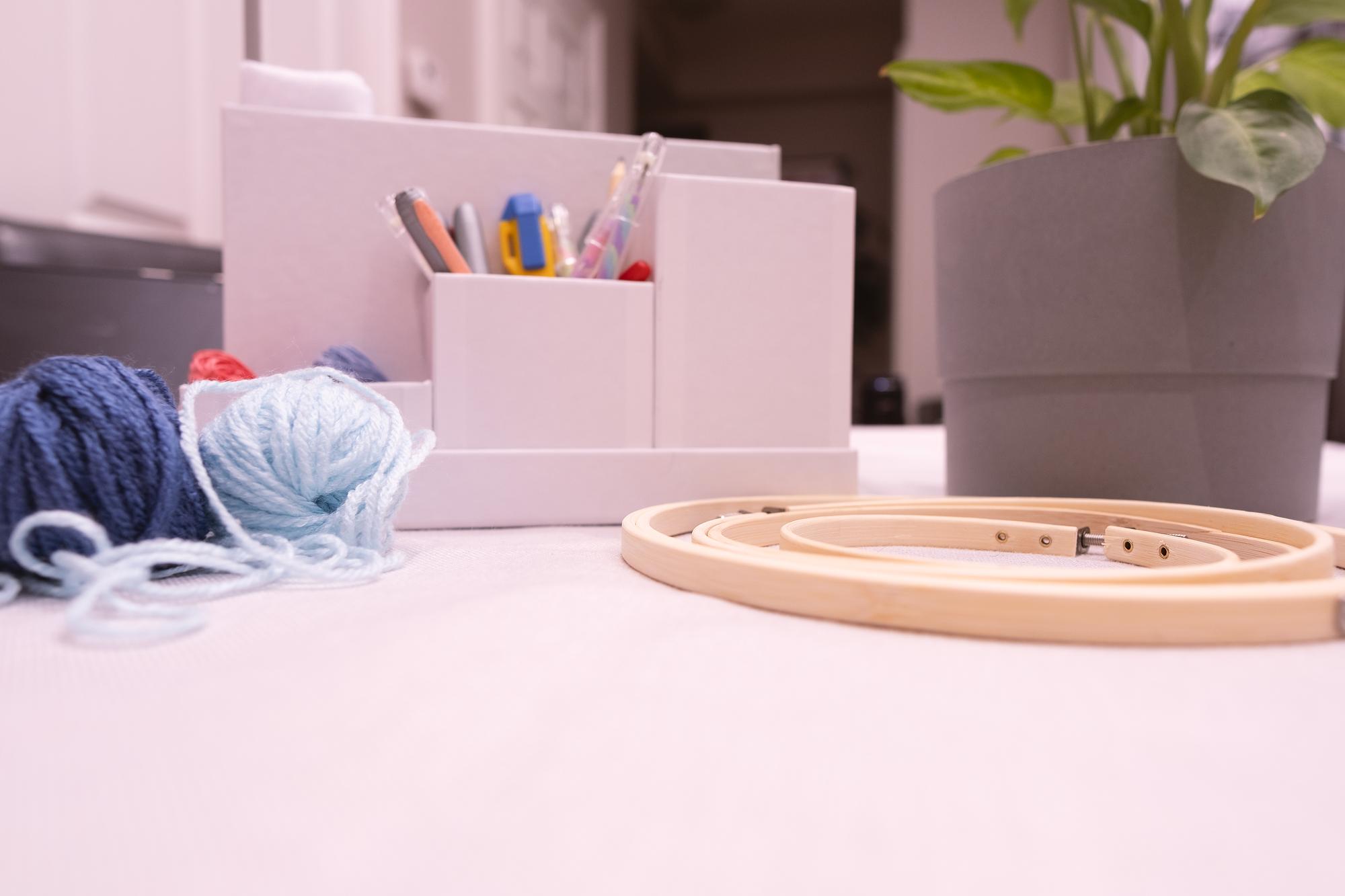 Studio workspace with threads and hoop