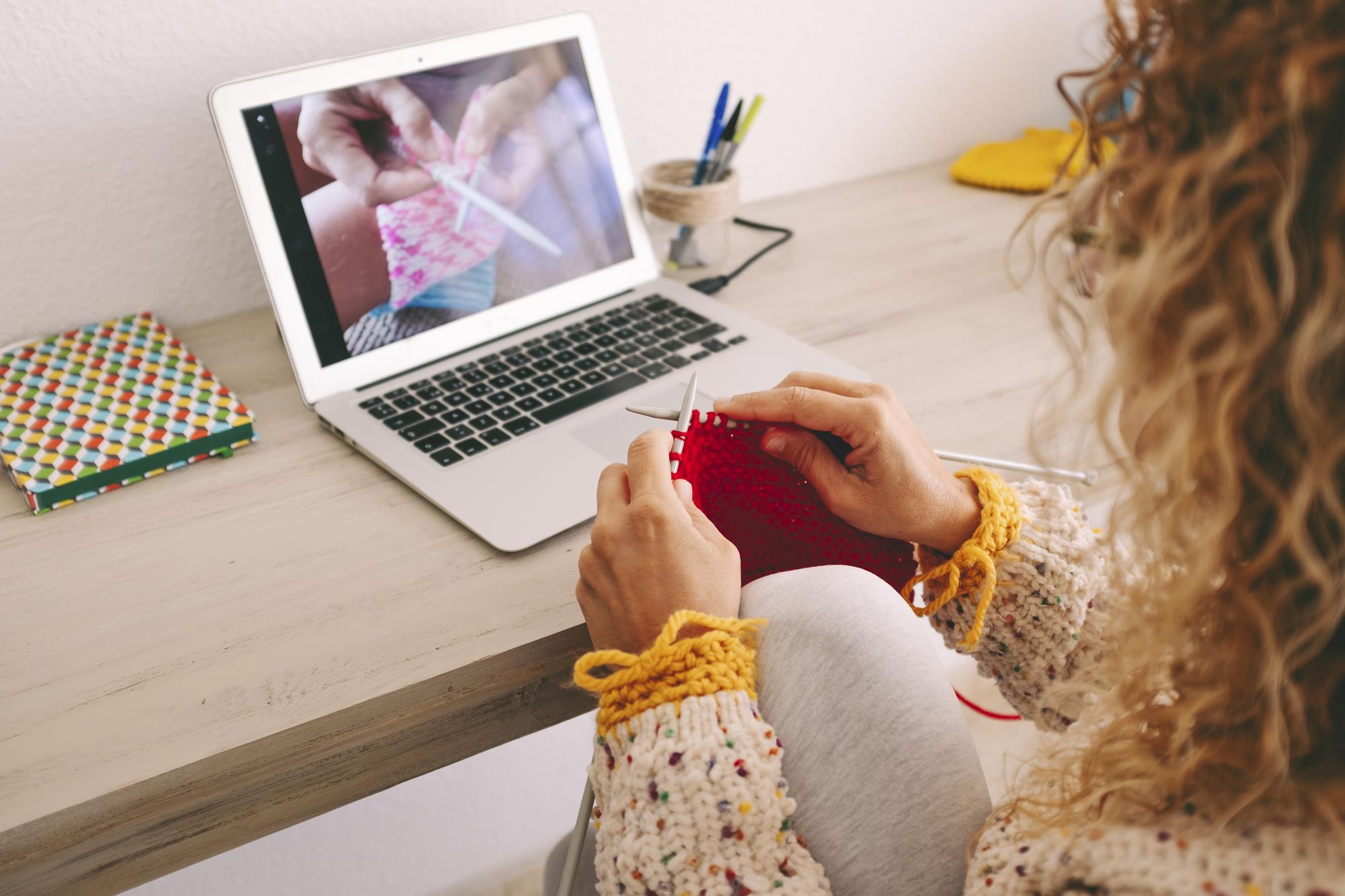 Instructor teaching online embroidery