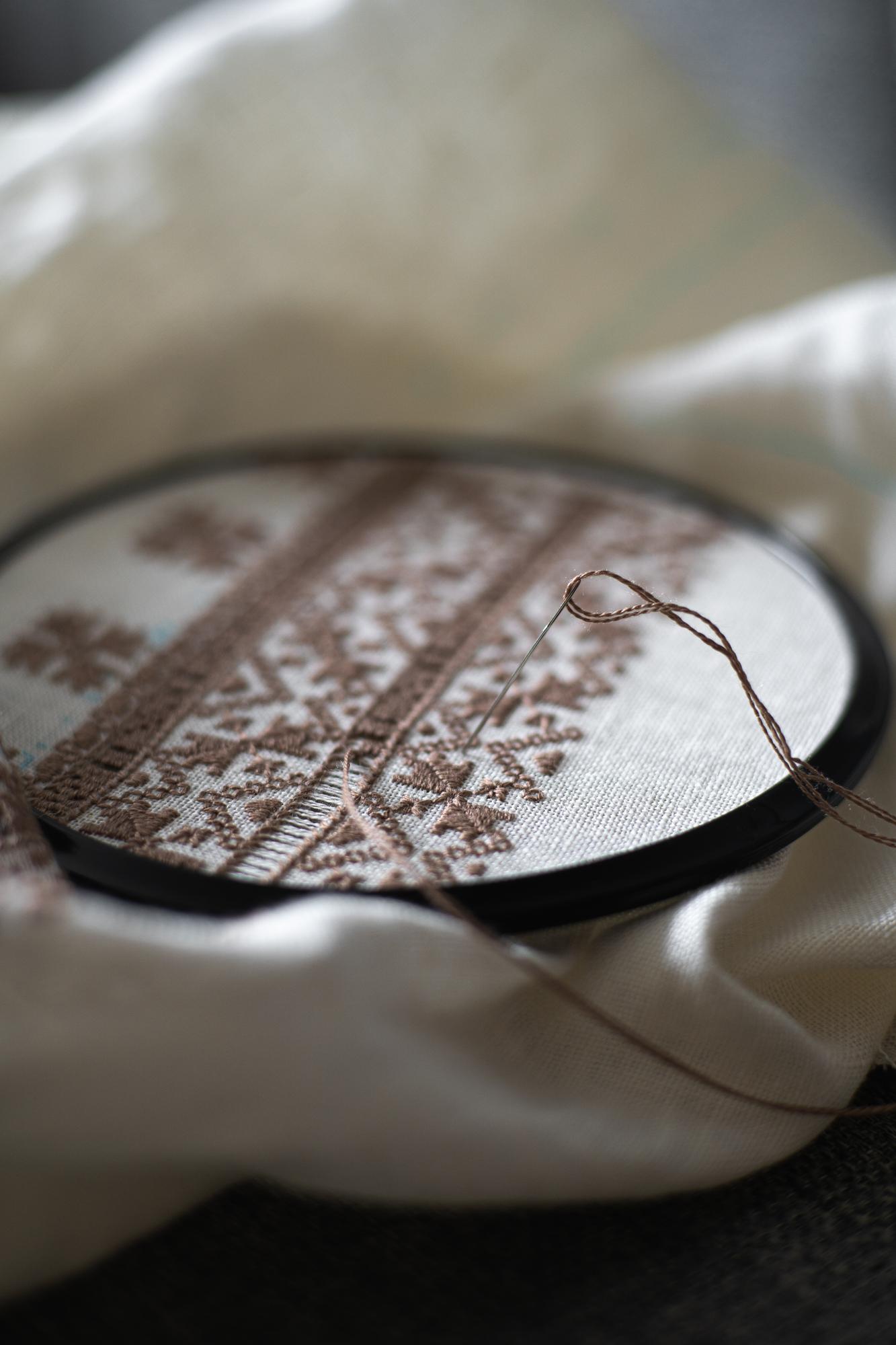 Close-up of luxury hand embroidery on linen